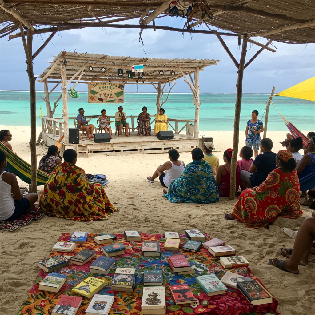 Literary beach event at Treasure Beach with authors, books, and families.
